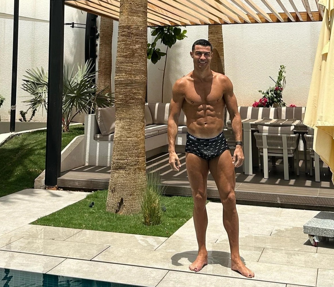 Cristiano Ronaldo showed off his abs as he enjoyed the sunshine