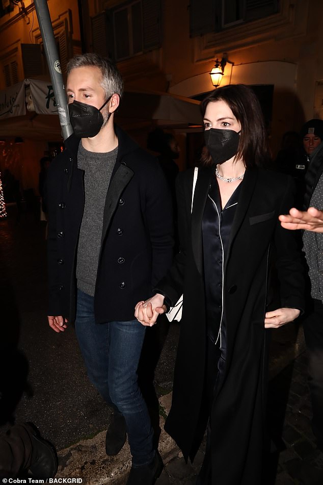 Loved-up: The couple made their way to dinner in Rome together later that day walking hand in hand