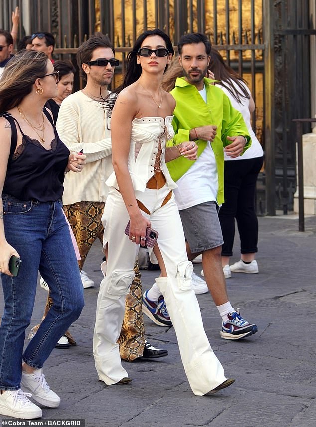 Striking: The singer, 26, looked sensational in a cleavage enhancing co-ord as she made her way around the historic city before heading to France for the next set of concerts