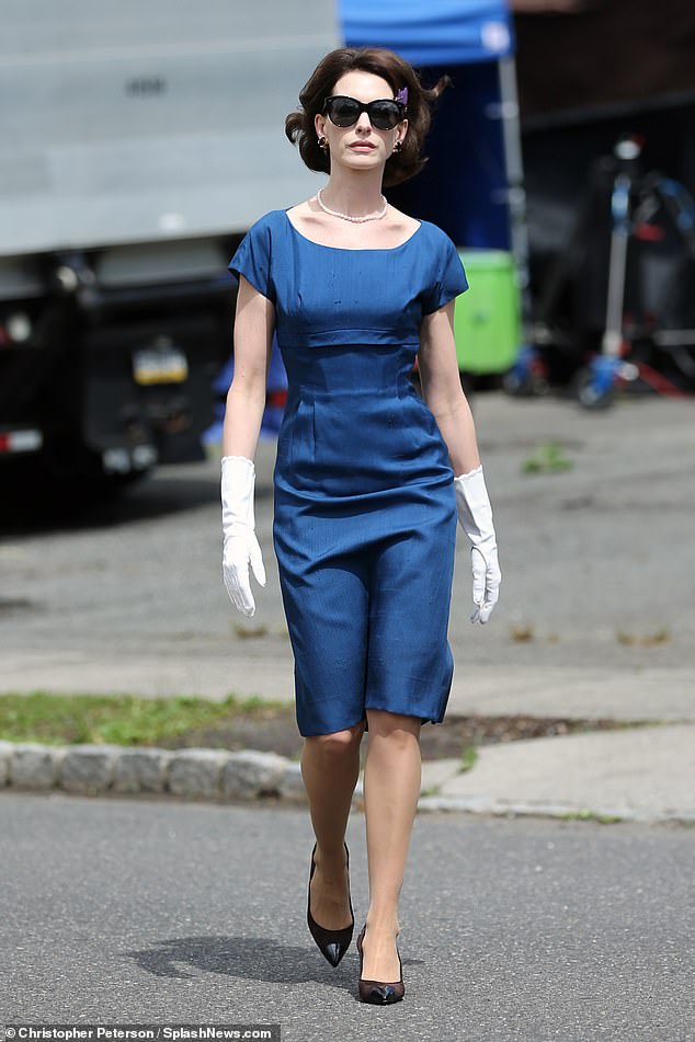 Star power: Anne Hathaway, 39, looked effortlessly elegant in a 1960s-style blue dress when she was seen Thursday on the set of Mother's Instinct with her costar Jessica Chastain, 45