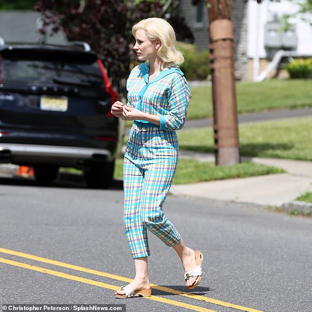 Eye-catching: Jessica contrasted her costar with a more garish aquamarine-and-gray plaid jumpsuit with a thick blue collar