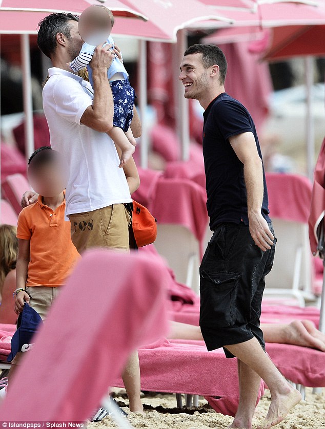 All smiles: The pair looked to be having a great time as they hit the sand together